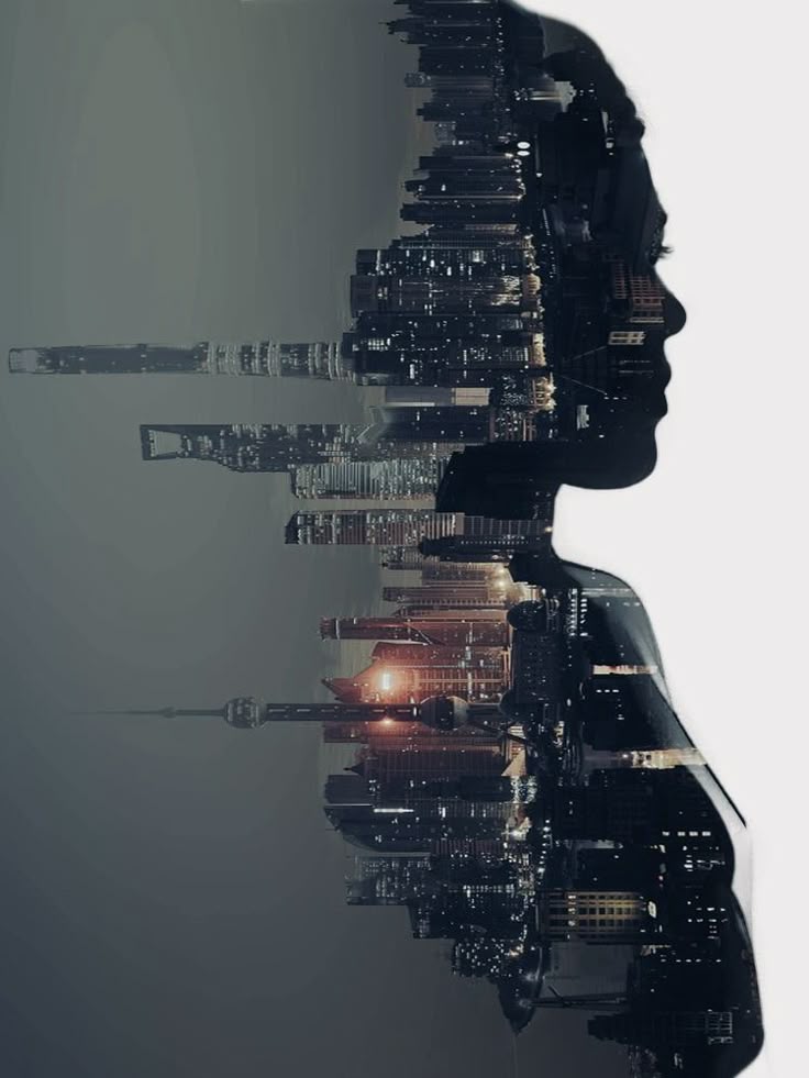Double-exposure portrait: a city skyline at dusk inside a person's silhouette
